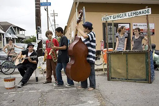 Jazz quartet plays outside in a city.