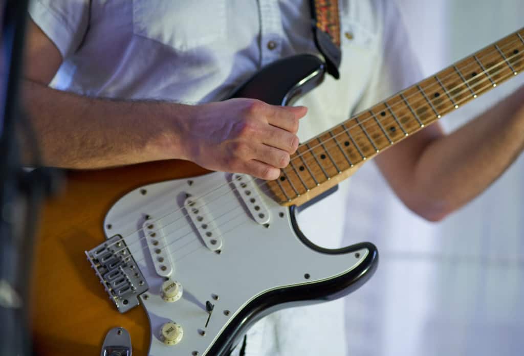 Man playing an electric guitar