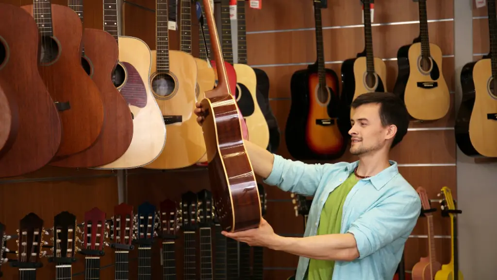 A man holding a guitar.