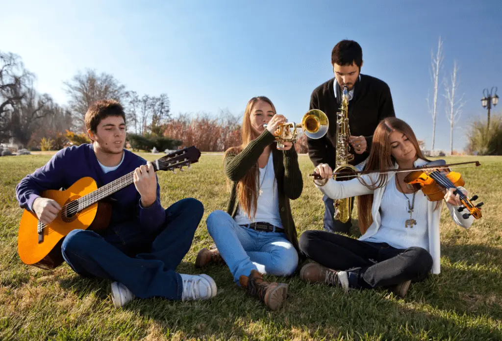 Four people playing instruments