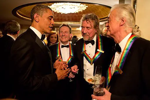 Led Zeppelin band members chatting with Barack Obama.