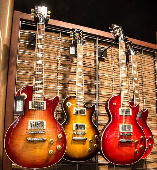 Four Gibson Les Paul guitars with block inlays