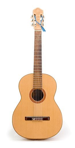 A classical guitar with no fret markers
