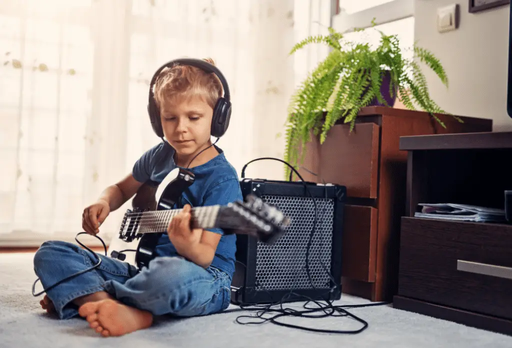 A child playing an electric guitar